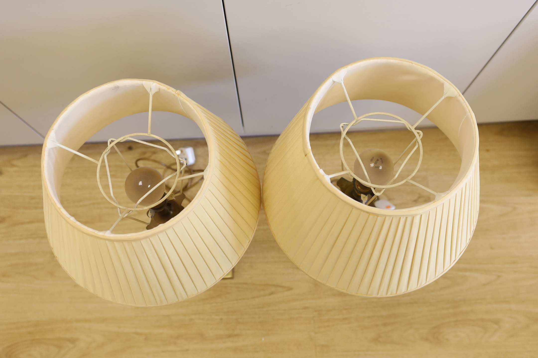 A pair of brass and glass Corinthian column table lamps, 52cm high not including light fitting